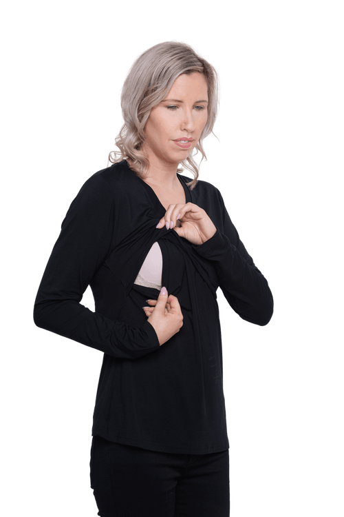 Curvy model facing camera wearing black, long sleeved, v-neck top, features small tie front under bust. Billie available in sizes 6-26