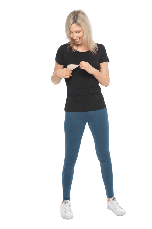 Petite model facing camera wearing black, short sleeved tee, features rounded neckline. Cindy available in sizes 6-18