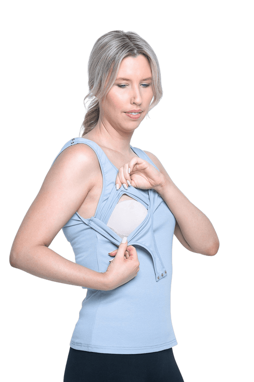 Curvy model facing camera wearing light blue tank top, features rounded neckline. Drew available in sizes 6-26