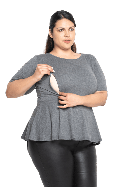 Petite model facing camera wearing charcoal grey short sleeved top. Featuring rounded neckline and peplum tier under bust. Isla available in sizes 6-26