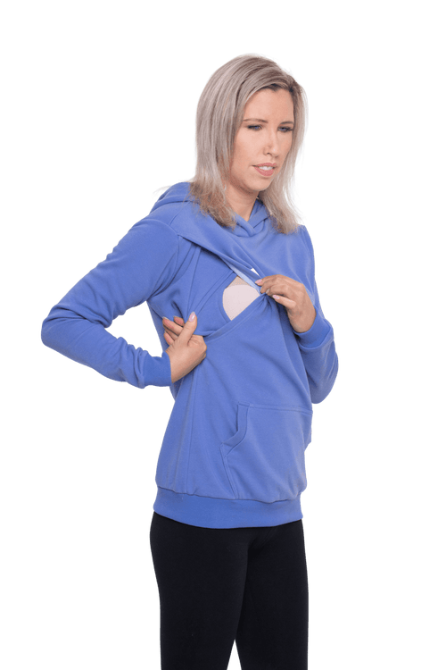 Petite model facing camera wearing cornflour blue hoodie, featuring front pocket, and white Mama print across the chest. Mama hoodie available in sizes 6-26