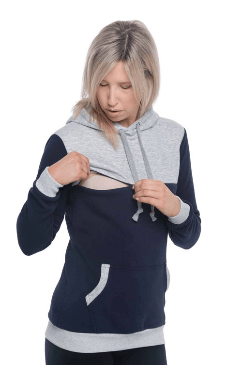 Petite model facing camera wearing navy hoodie with grey panel over chest, shoulders, and top of back, featuring front pocket, and grey highlights at pocket openings and sleeve cuffs. Olivia hoodie available in sizes 6-26