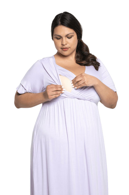Petite model facing camera wearing lilac maxi dress, featuring crossover V-neck, double layer detailed sleeves, pockets and a beautiful Grecian flowing silhouette. Phoebe available in sizes 6-26