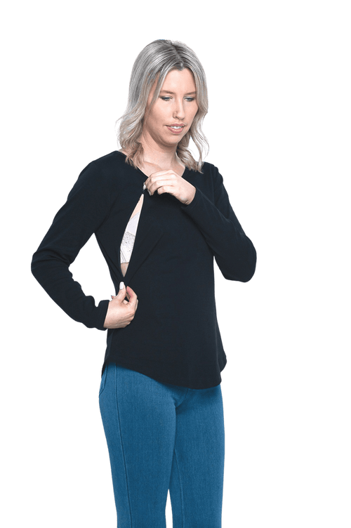 Petite model facing camera wearing black long sleeved top, featuring soft V-neck and a scooped hem. Reese available in sizes 6-26