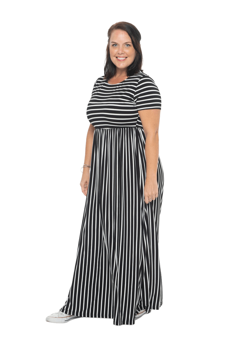 Brunette model facing the side wearing black and white striped maxi dress, featuring rounded neckline, and a gently fitted bodice, gathering above the waist. Riley available in sizes 6-18