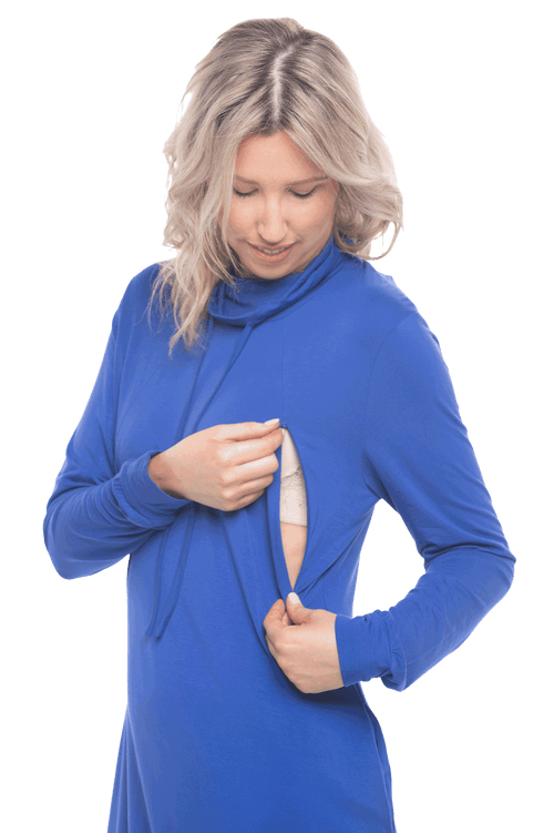 Petite model facing the camera wearing cobalt blue long sleeved tunic as a dress with boots, featuring pockets and a faux hoodie collar in a comfy, relaxed fit. Tori available in sizes 6-18