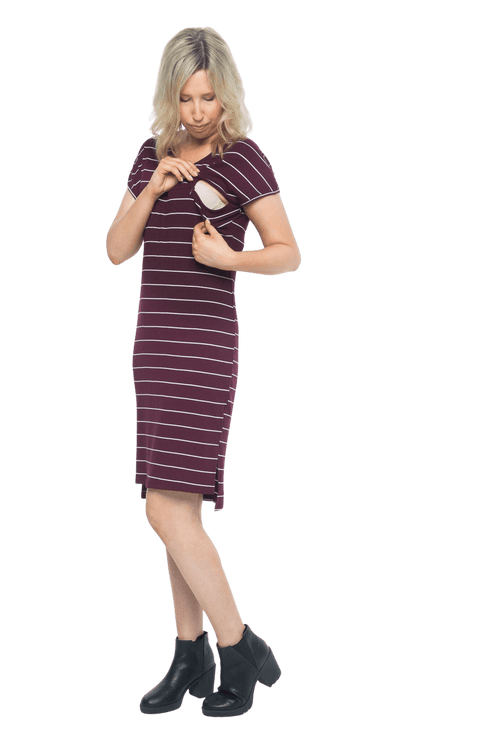 Petite model facing the camera wearing maroon with white pin striped shift dress, featuring slight v neck and side splits. Zoe available in sizes 6-18
