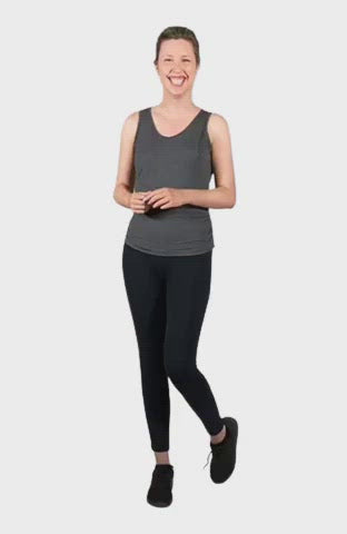 Petite model wearing charcoal grey tank top, featuring rounded neckline and side rouching. Adrien available in sizes 6-26