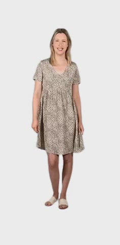Petite model wearing knee length, leopard print dress, featuring soft v-neck. Avery available in sizes 6-26