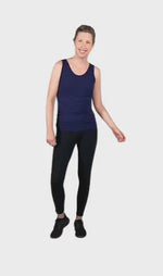 Petite model wearing navy blue tank top, featuring rounded neckline and side rouching. Adrien available in sizes 6-26