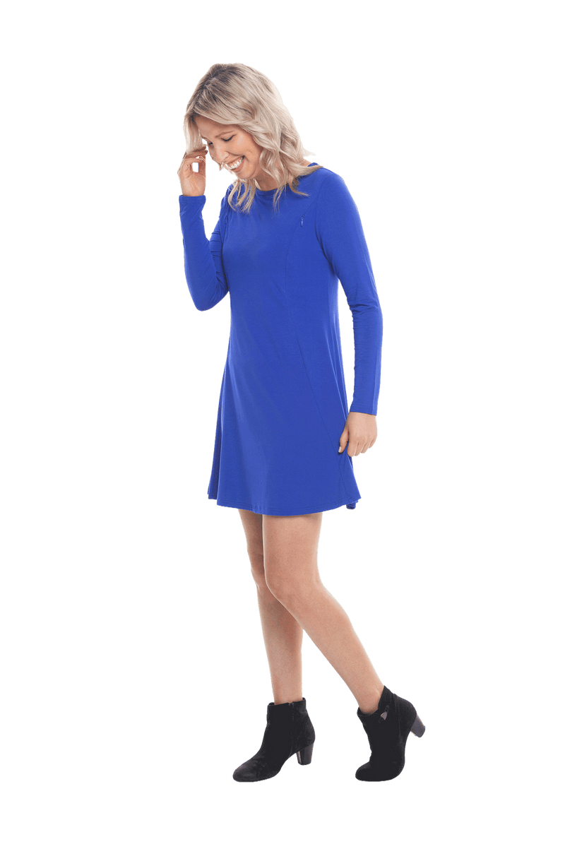 Petite model facing the side wearing royal blue A-line swing dress, featuring rounded neckline. Amber available in sizes 6-18