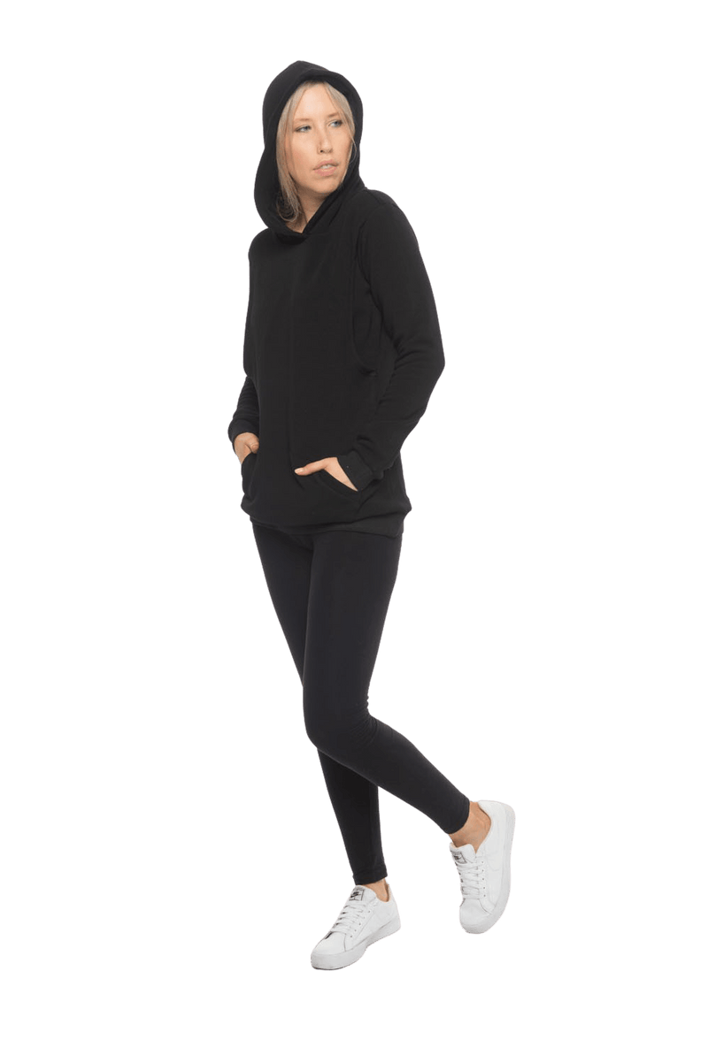 Petite model facing the side wearing black hoodie with a front pocket. Andrea available in sizes 6-18