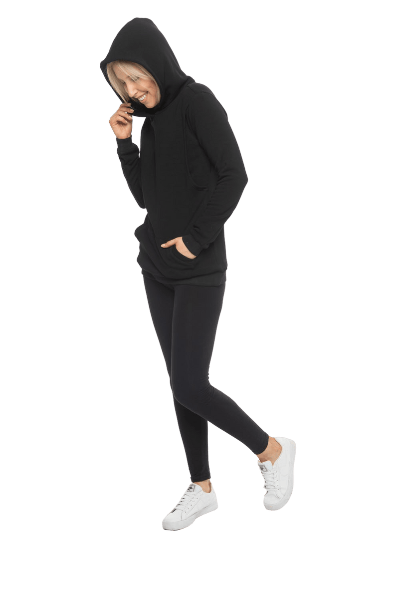 Petite model facing the side wearing black hoodie with a front pocket. Andrea available in sizes 6-18