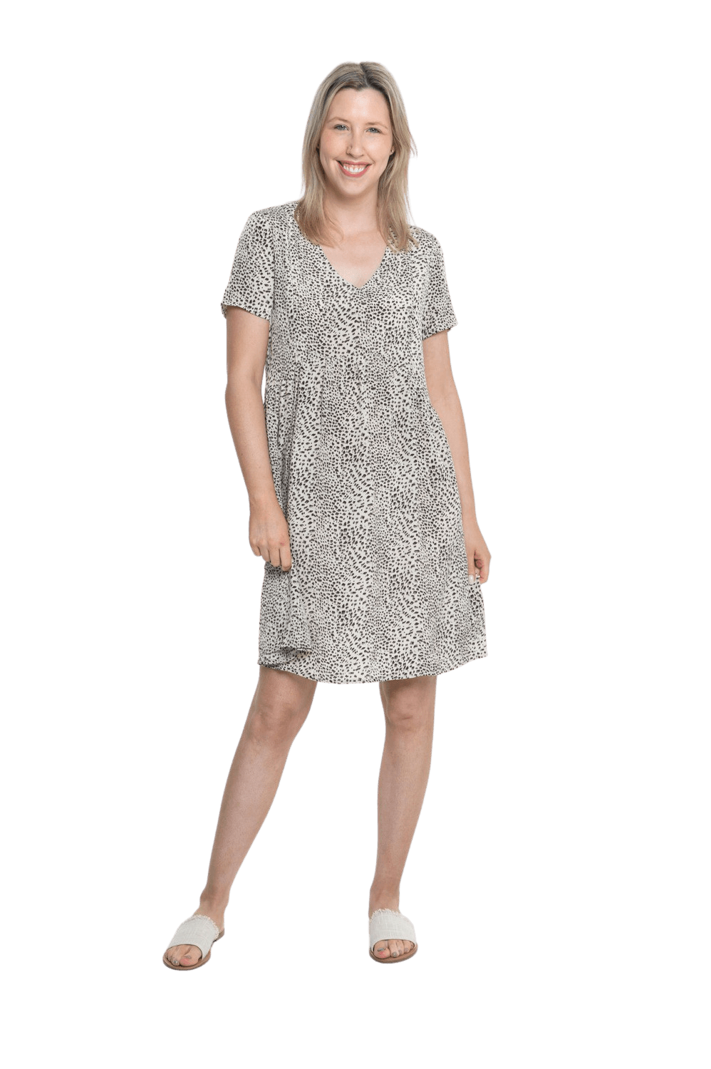 Petite model facing camera wearing knee length, leopard print dress, featuring soft v-neck. Avery available in sizes 6-26