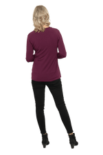 Petite model facing the back wearing burgundy, long sleeved, v-neck top, features small tie front under bust. Billie available in sizes 6-26