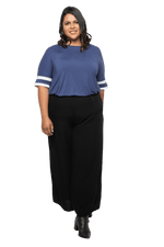 Curvy model facing camera wearing navy blue, short sleeved, relaxed fit top, features rounded neckline and two white varsity stripes on the sleeve. Cameron available in sizes 6-26