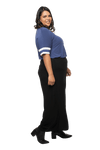 Curvy model facing the side wearing navy blue, short sleeved, relaxed fit top, features rounded neckline and two white varsity stripes on the sleeve. Cameron available in sizes 6-26