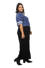 Curvy model facing the side wearing navy blue, short sleeved, relaxed fit top, features rounded neckline and two white varsity stripes on the sleeve. Cameron available in sizes 6-26