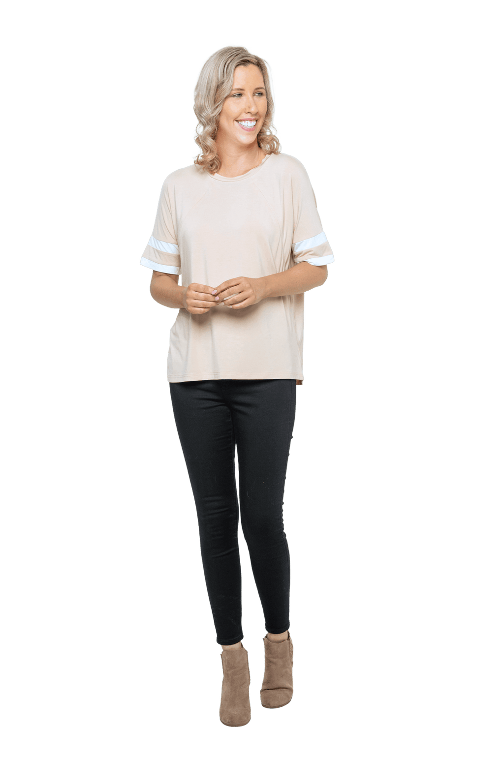 Petite model facing camera wearing sand, short sleeved, relaxed fit top, features rounded neckline and two white varsity stripes on the sleeve. Cameron available in sizes 6-26