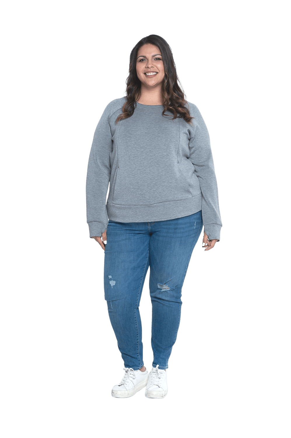 Curvy model facing camera wearing grey crew necked jumper, featuring thick, flat waist band, thumb holes, and pockets. Cassie available in sizes 6-26