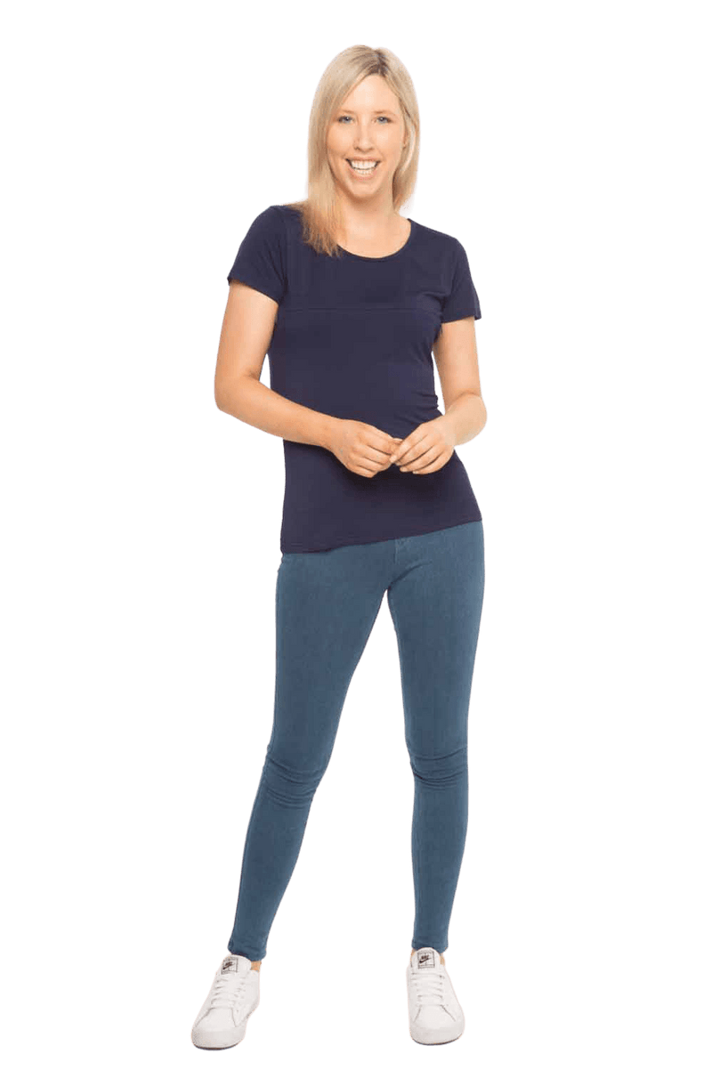 Model facing camera wearing navy blue, short sleeved tee, features rounded neckline. Cindy available in sizes 6-18