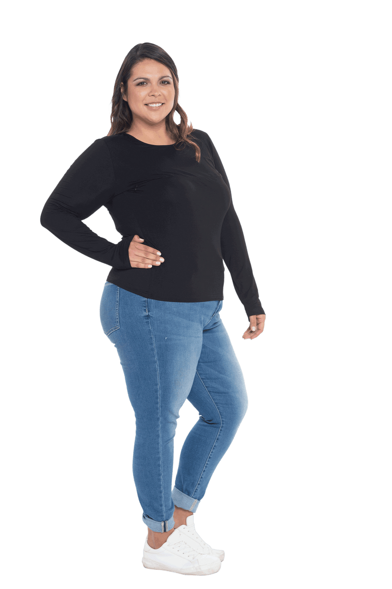 Curvy model facing the side wearing black, long sleeved tee, features rounded neckline. Cindy available in sizes 6-26