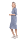 Model facing the side wearing blue gingham, mid-length sleeved midi dress, features rounded neckline, tiered skirt and pockets. Dorothy available in sizes 6-18