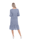 Model facing the back wearing blue gingham, mid-length sleeved midi dress, features rounded neckline, tiered skirt and pockets. Dorothy available in sizes 6-18