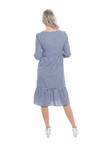 Model facing the back wearing blue gingham, mid-length sleeved midi dress, features rounded neckline, tiered skirt and pockets. Dorothy available in sizes 6-18