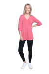 Petite model facing camera wearing pink, mid-length sleeved top. Features button up v-neckline and peplum tier under bust. Dylan available in sizes 6-26