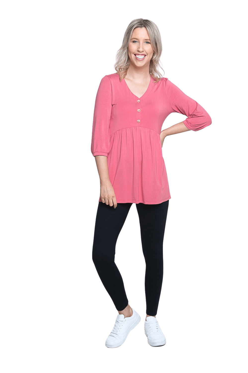 Petite model facing camera wearing pink, mid-length sleeved top. Features button up v-neckline and peplum tier under bust. Dylan available in sizes 6-26
