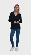 Petite model wearing black, long sleeved, v-neck top, features small tie front under bust. Billie available in sizes 6-26