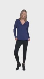 Model wearing navy blue, long sleeved henley top, slightly unbuttoned. Features button front and dropped shoulder. Hunter available in sizes 6-26