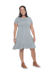 Model facing camera wearing grey, short sleeved, knee length, A-line dress. Features rounded neckline. Emma available in sizes 6-18