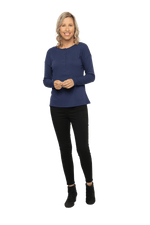 Petite model facing camera wearing navy blue, long sleeved henley top. Features button front and dropped shoulder. Hunter available in sizes 6-26