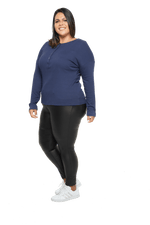 Curvy model facing the side wearing navy blue, long sleeved henley top. Features button front and dropped shoulder. Hunter available in sizes 6-26