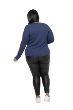Curvy model facing the back wearing navy blue, long sleeved henley top. Features button front and dropped shoulder. Hunter available in sizes 6-26