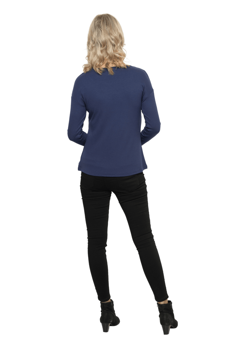 Petite model facing the back wearing navy blue, long sleeved henley top. Features button front and dropped shoulder. Hunter available in sizes 6-26