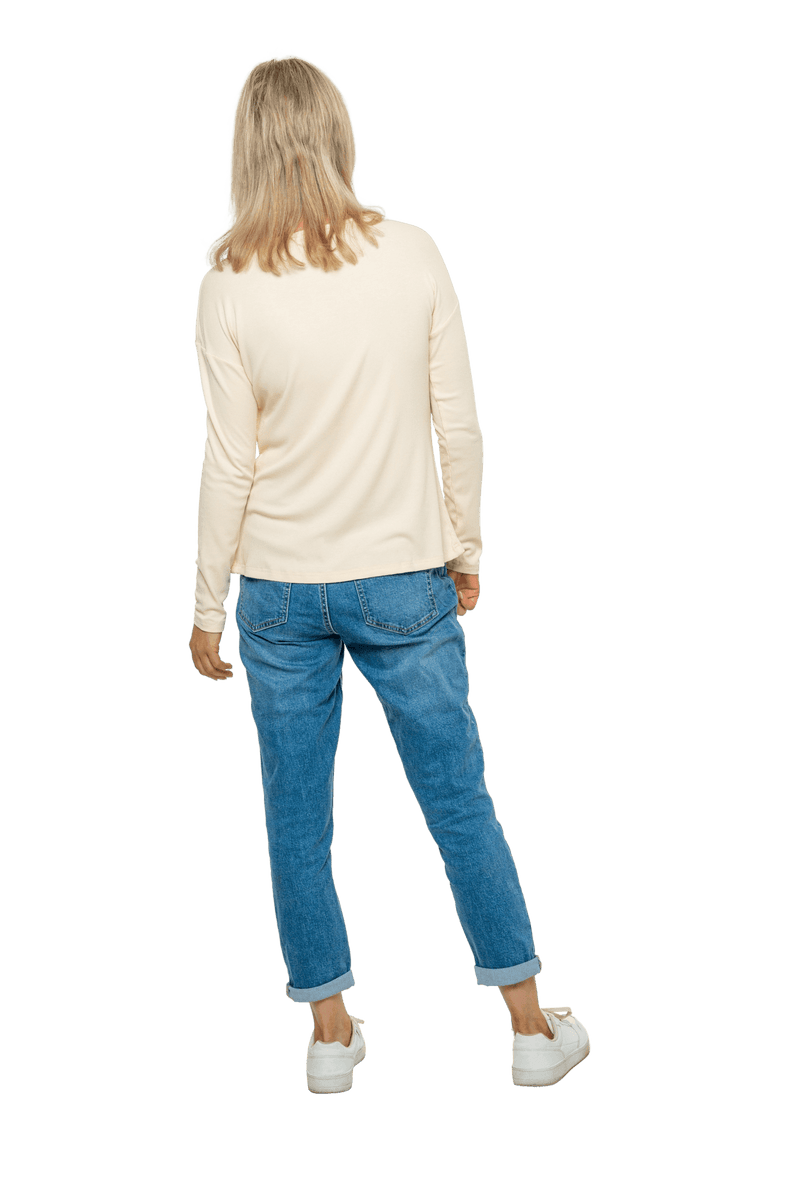 Petite model facing the back wearing sand, long sleeved henley top. Features button front and dropped shoulder. Hunter available in sizes 6-26