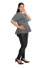 Curvy model facing the side wearing charcoal grey short sleeved top. Featuring rounded neckline and peplum tier under bust. Isla available in sizes 6-26
