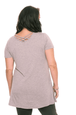 Model facing the back wearing grey, short sleeved top. Showing criss cross design below neckline. Jade available in sizes 6-18