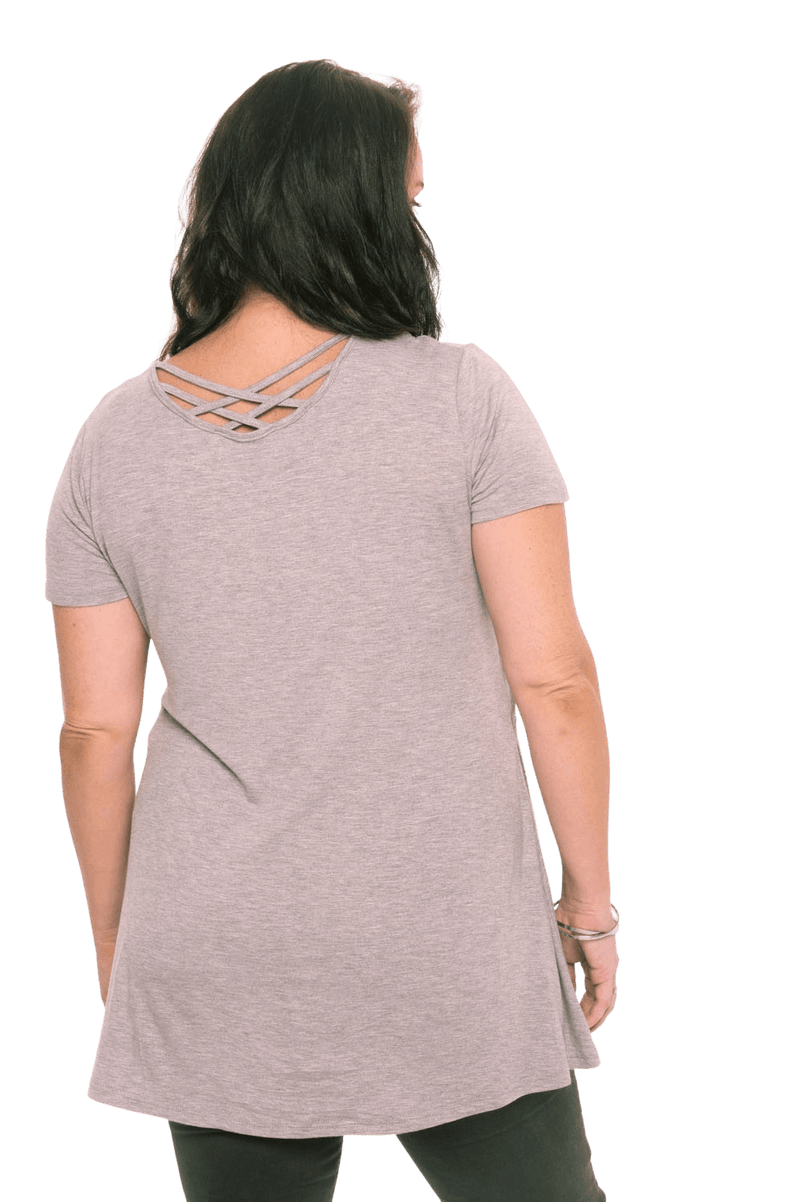 Model facing the back wearing grey, short sleeved top. Showing criss cross design below neckline. Jade available in sizes 6-18