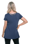 Model facing the back wearing navy blue, short sleeved top. Showing criss cross design below neckline. Jade available in sizes 6-18