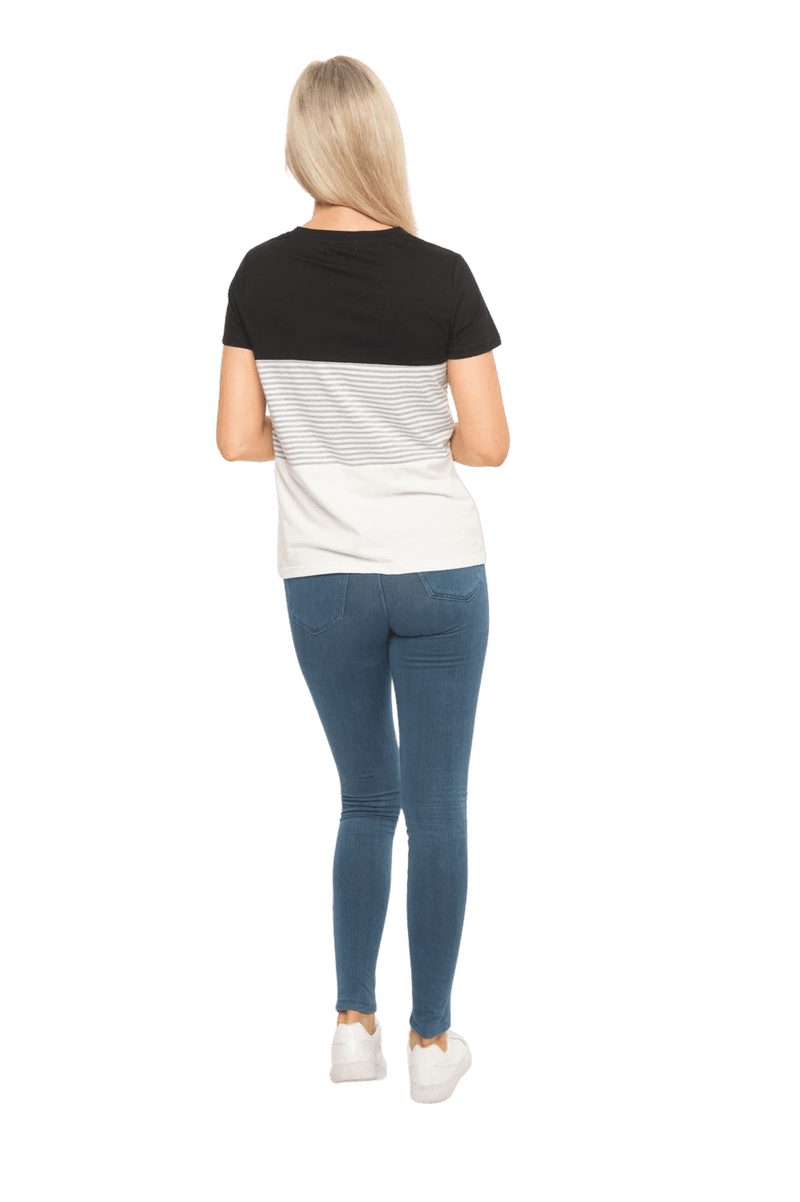 Petite model facing the back wearing colour blocked, short sleeved tee. Features rounded neckline. Jamie available in sizes 6-26