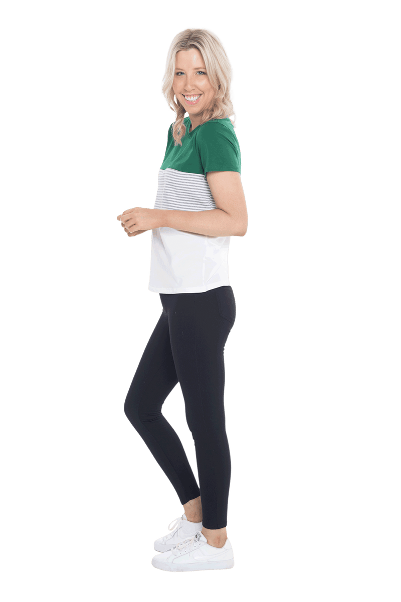 Petite model facing the side wearing colour blocked, short sleeved tee. Features rounded neckline. Jamie available in sizes 6-26