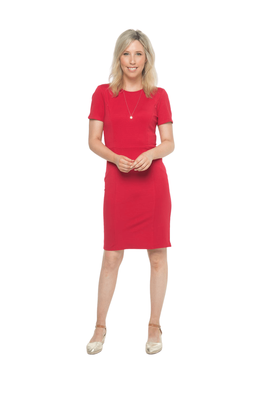 Petite model facing camera wearing red dress, featuring rounded neckline, back zip and an elegant, fitted silhouette. Juliet available in sizes 6-18