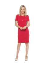 Petite model facing camera wearing red dress, featuring rounded neckline, back zip and an elegant, fitted silhouette. Juliet available in sizes 6-18