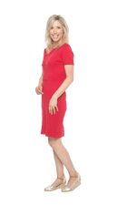 Petite model facing the back wearing red dress, featuring rounded neckline, back zip and an elegant, fitted silhouette. Juliet available in sizes 6-18