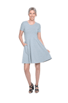 Petite model facing camera wearing grey with white pin striped, knee length dress, featuring rounded neckline, fitted bodice, pleated A-line skirt and pockets. Kaitlyn available in sizes 6-26