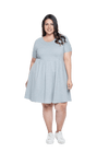 Curvy model facing camera wearing grey with white pin striped, knee length dress, featuring rounded neckline, fitted bodice, pleated A-line skirt and pockets. Kaitlyn available in sizes 6-26